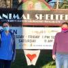 The FARVets team poses in front of the Tri-Lakes Humane Society Animal Shelter sign