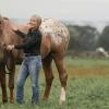 Lisa Fortier with a horse at the Cornell Equine Park