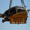 A rhino suspended in the air on its side, in a photo by the Namibian Ministry of Environment