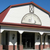 The exterior of the Saratoga County Animal Shelter against a bright blue sky