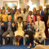 Veterinarians in the Bahamas at a continuing education event, seated and smiling at the camera