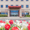 The entrance of the Cornell University Hospital for Animals, with tulips in the foreground