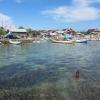 A young boy swims above seagrass meadows close to shore on an Indonesian island. The seagrass reduces bacterial exposure for corals, sea creatures and humans