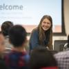 A student talks to others before the opening remarks at the 2018 animal hackathon