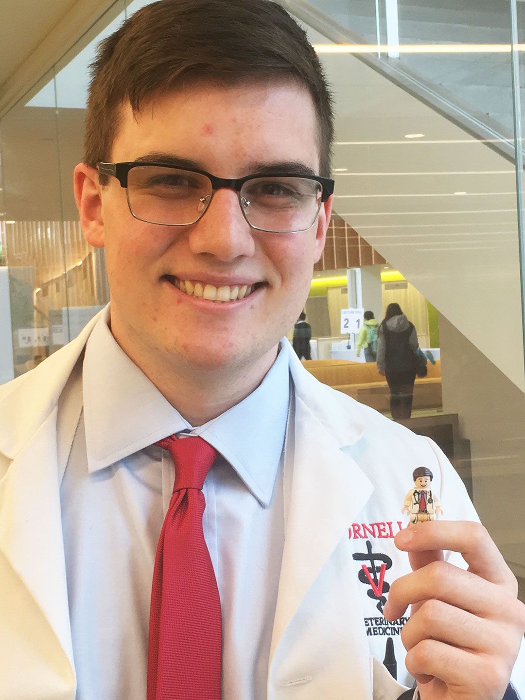 Samuel Burkhardt with a LEGO figurine of himself